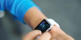 Person Checks Stats On The Screen Of Their Apple Watch. Original