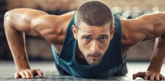 Determined Man Doing Push Ups At The Gym